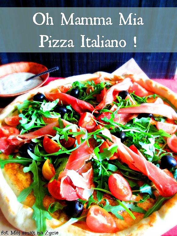 Pizza z rukolą, prosciutto, pomidorkami i oliwkami